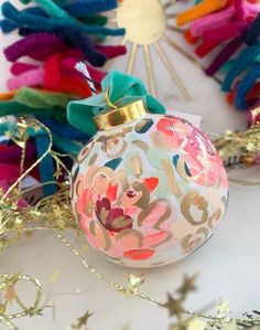 a colorful ornament with a bow on it