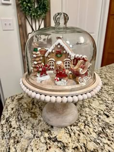 Photo belongs to Wanda Hewitt posted on Farmhouse is My House Cheese Dome Christmas Decor, Kitchen Gingerbread Decor, Gingerbread Mantle Decor, Gingerbread Christmas Decor Kitchen, Christmas Terrariums, Peppermint Decor, Gingerbread Kitchen, Christmas Whimsy