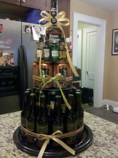 a large stack of beer bottles sitting on top of a counter