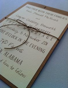 the wedding stationery is laid out on top of the table for guests to sign