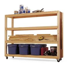 a wooden shelf with bins and containers on it