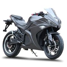 a grey motorcycle is parked on a white surface and it's front wheel has two spokes