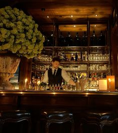 a bartender behind the bar at a restaurant