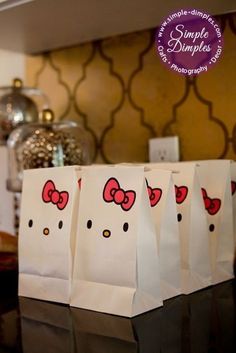 hello kitty bags sitting on top of a counter