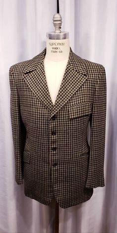 Beautiful houndstooth cloth two piece suit probably made in the 70's but exceptional quality. With the proper accessories it would be hard to tell this is not a true period piece, but the next best thing. Ready for the Dickens Faire or a period holiday party. Inside label reads: Mike Bain Inside pocket still has the Amalgamated Union Tag made in the USA the United States of America. Coat measures: Shoulders 18 1/2 inches, Chest 45 inches, sleeves 25 inches and length is 31 inches. Pants measure: Semi-formal Tweed Jacket With Houndstooth Pattern And Suit Collar, Semi-formal Houndstooth Tweed Jacket With Suit Collar, Semi-formal Tweed Jacket With Houndstooth Pattern, Semi-formal Houndstooth Tweed Jacket, Fitted Vintage Outerwear With Houndstooth Pattern, Vintage Houndstooth Outerwear With Notch Lapel, Vintage Tailored Tweed Jacket For Formal Occasions, Retro Plaid Formal Blazer, Retro Plaid Blazer For Formal Occasions