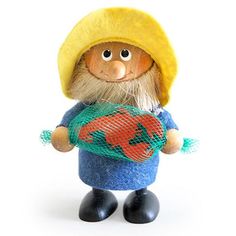 a small toy with a yellow hat and blue shirt holding a green netted bag