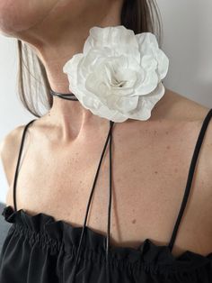 Silk flower choker with black ribbon (can be used as a bracelet). Rose flower in white color.  Made individually from 100% silk.  It can add a touch of elegance to clothing or accessories, making a statement or celebrating personal style. Gift for her. use it as accessory for wedding outfit. Worldwide shipping. Standart International Delivery from Latvia(Europe) with Latvijas Pasts. To U.S. usually takes about 10-14 business days. Europe 3-7 days.  I'll do my best to manage these delivery estima Rosette Necklace Outfit, White Flower Choker Necklace Gift, Elegant White Flower Choker, Large Flower Choker, Luxury White Flower-shaped Necklaces, Luxury White Flower-shaped Necklace, Necklace Outfit, Flower Choker, Black Ribbon