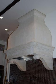 a white stove top oven sitting inside of a kitchen