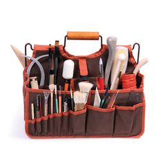 an orange and brown organizer filled with lots of tools