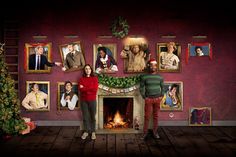 two people standing in front of a fireplace with christmas pictures on the wall behind them