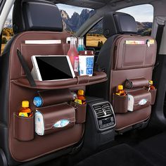 the back seat of a car with bottles and drinks in it