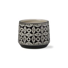 a black and white vase with geometric designs