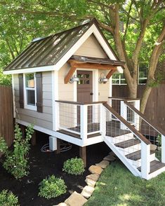 a small house with stairs leading up to it