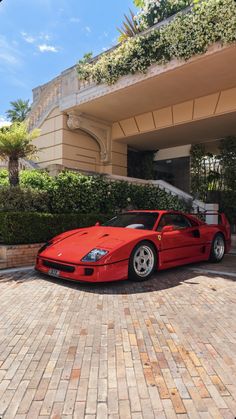 a red sports car parked in front of a building