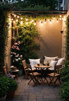 an outdoor dining area is lit up with string lights and potted plants on the patio