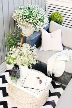 a couch and table with flowers on it