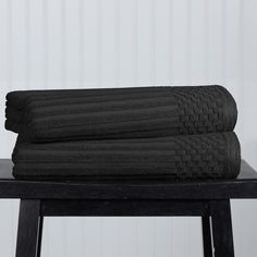 two black towels stacked on top of each other