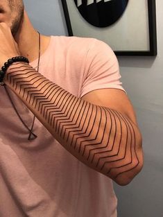 a man with a tattoo on his arm