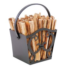 a metal basket filled with lots of wooden sticks on top of a white background,