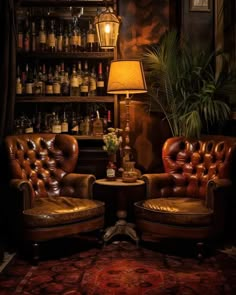 two leather chairs sitting next to each other in front of a shelf with bottles on it