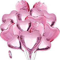 a bunch of pink heart shaped balloons in the shape of hearts on a white background