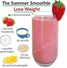 a smoothie is in a glass with strawberries and other ingredients to make it