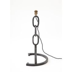 an iron hook with a chain hanging from it's end on a white background