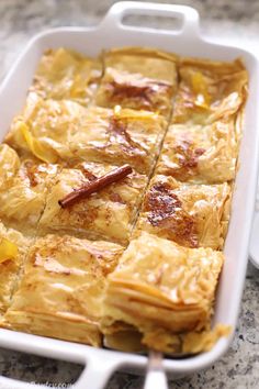 a casserole dish with pineapples and cinnamon on top is ready to be eaten