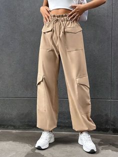 Stay comfortable and stylish with these Elastic Knot Detail Pants with Pocket. These pants feature an elastic waistband with a knot detail, adding a trendy and chic element to the design. The pocket provides functional storage space while enhancing the overall style. Whether you pair them with a casual tee or a flowy blouse, these elastic knot detail pants with pocket will give you a fashionable and effortless look. Specifications: Style: Casual Type: Cargo Pants Details: Knot, Pocket, Paperbag Trendy Tie Waist Pants, Trendy Tie Waist Pants For Fall, Casual Beige High-waisted Harem Pants, Chic Khaki Bottoms With Side Pockets, Trendy Trousers With Tie Waist, Casual High Waist Khaki Harem Pants, Casual Solid Bottoms With Tie Waist, Trendy Solid Bottoms With Tie Waist, Beige Long Harem Pants With Pockets