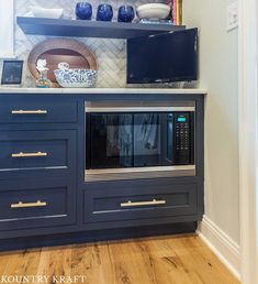 an oven built into the side of a cabinet