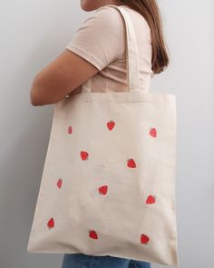 Strawberry Canvas Tote Bag Design ✰ 14.75" x 16.5" Bag (No Zipper) -- Available in canvas, black, blue, pink, green and red Made of 100% natural cotton processed AZO-Free -- and locally sourced Perfect as a grocery bag, visiting farmer markets, book bag, beach bag and in replace of a purse. NOTE: Recommend hand washing certain parts of the tote bag that need serious cleaning otherwise washing it in a washing machine may result in shrinkage! ✰ Free Shipping Across Canada | Orders are shipped usin Trendy Red Canvas Bag, Red Cotton Canvas Shopping Bag, Red Cotton Canvas Bag For Shopping, Red Eco-friendly Canvas Shopping Bag, School Cotton Tote Shoulder Bag, Cotton Canvas Shoulder Bag For Shopping, Cotton Tote Shoulder Bag For School, Eco-friendly Red Canvas Bag For Daily Use, Red Cotton Shoulder Bag For Daily Use