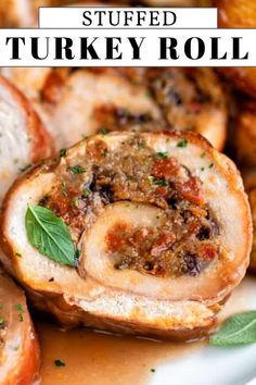 stuffed turkey rolls on a plate with sauce and herbs