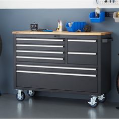 a tool cabinet sitting on top of a hard wood floor