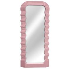 a pink mirror sitting on top of a white wall