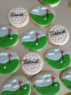 decorated cookies are arranged in the shape of golf balls