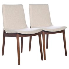 pair of mid century modern dining chairs with upholstered backrests in walnut