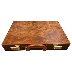 a large wooden box with handles is shown on a white background and has a leather handle