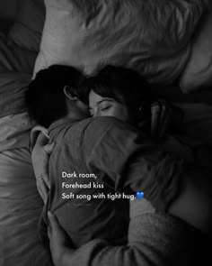 a man and woman cuddling in bed with the caption dark room, foreheadd kiss soft along with high hugs