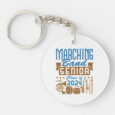 a white keychain with the words marching band senior class of 2014 on it