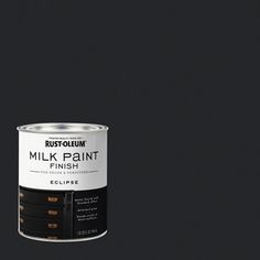 a can of milk paint on a black background