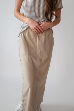 Looking for modest options to accompany your active lifestyle? This high quality, athletic maxi skirt looks slimming but has enough stretch, along with a comfortable elastic waist, for rigorous activities. The nylon fabric dries quickly and wipes clean. The Callie is complete with cinching detail on the right side, which also serves the purpose of pulling your skirt a little higher when wading along the beach or scrambling over rough terrain. The Callie might become your go-to piece for your fav Modest Stretch Midi Skirt, Modest Stretch Skirt With Elastic Waistband, Versatile Cotton Lined Skirt Bottoms, Versatile Cotton Lined Skirt, Versatile Skirt With Side Pockets For Spring, Versatile Solid Color Maxi Skirt With Elastic Waistband, Versatile Stretch Cotton Skirt, Casual Stretch Pencil Skirt, Versatile Cotton Skirt With Relaxed Fit