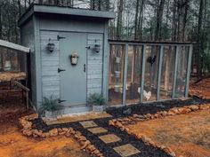 a chicken coop in the middle of a yard