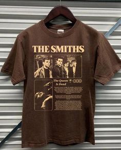 The Smiths music band,  The Smiths 90s, Smiths Album graphic 2024  shirt, The Smiths  graphic Gift for men, women Comfort color ABOUT MATERIAL: Comfort Colors® 1717 Made with medium fabric (6.1 oz/yd² (206.8 g/m consiting of high quality, 100% ring-spun US cotton for long-lasting comfort. The relaxed fit keeps the wearer comfy in both casual and semi-formal settings while the crew neckline delivers that classic, neat style which makes it perfect for accessorizing. What's more, the pre-shrunk fabric ensures a consistently great fit. Made using 100% US cotton that is ethically grown and harvested. Gildan is also a proud member of the US Cotton Trust Protocol ensuring ethical and sustainable means of production. How to wash Comfort Color :Machine wash: cold (max 30C or 90F); Do not bleach; Tu The Smiths Tshirt, The Smiths Shirt, The Smiths T Shirt, The Queen Is Dead, The Smiths, Music Band, Swaggy Outfits, Band Shirts, Dream Clothes