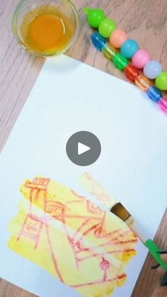 an image of a child's drawing on paper with crayons and markers