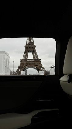 the eiffel tower seen from inside a car