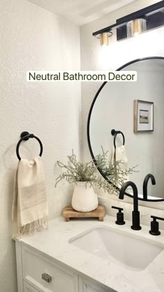 a bathroom with a sink, mirror and towel rack