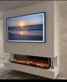 a television mounted on the wall above a fireplace