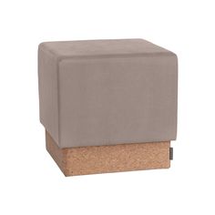 a small stool with a cork block on the bottom and an open end, in grey fabric