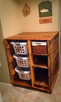 an old wooden cabinet with baskets on it