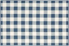 a blue and white checkered fabric with a ruler in front of the plaid pattern